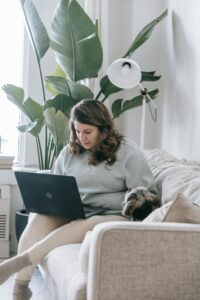 busy dog owner multitasking with puppy chaos at home